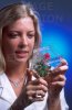 usda_technician_examining_a_rose_plant.jpg